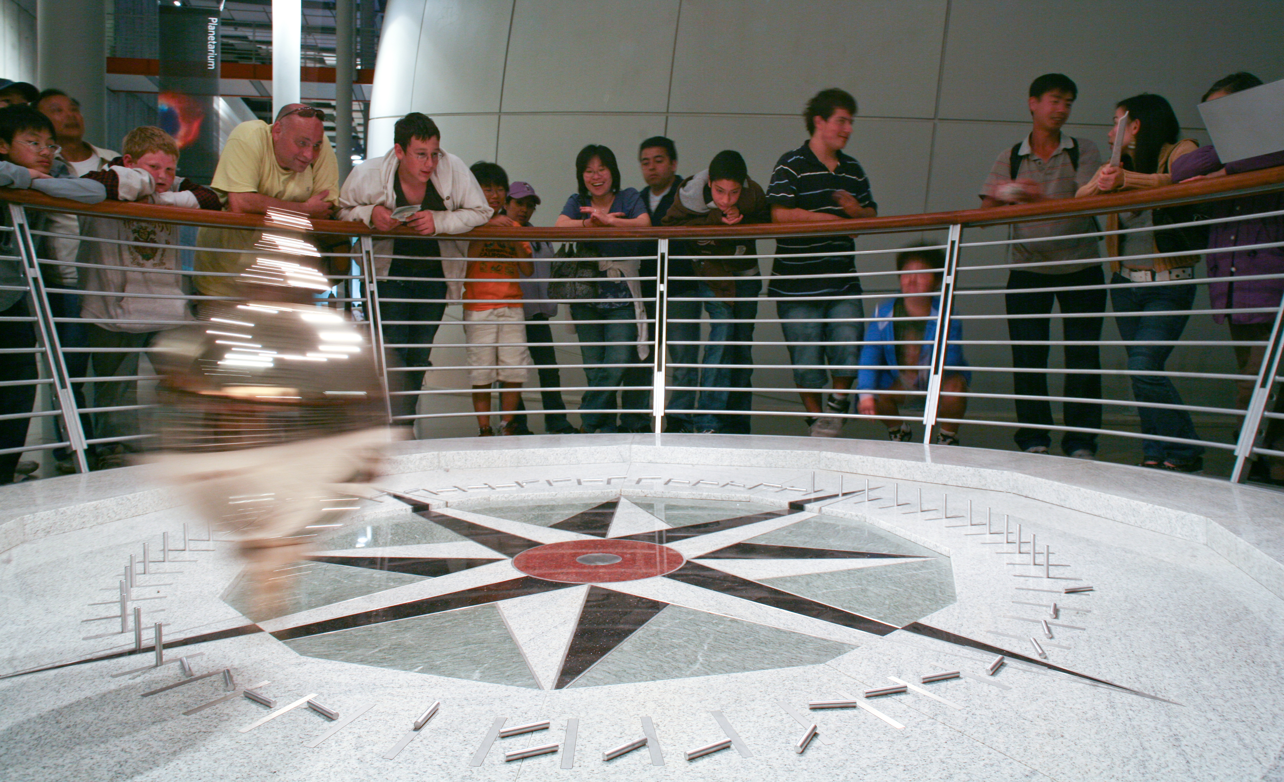 a photo of the Foucault Pendulum Clock at the California Academy of Sciences